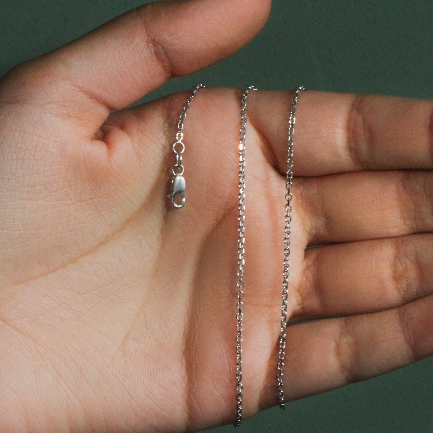 Peelerie jewelry piece in midnight luxury editorial product photo, high-contrast studio lighting