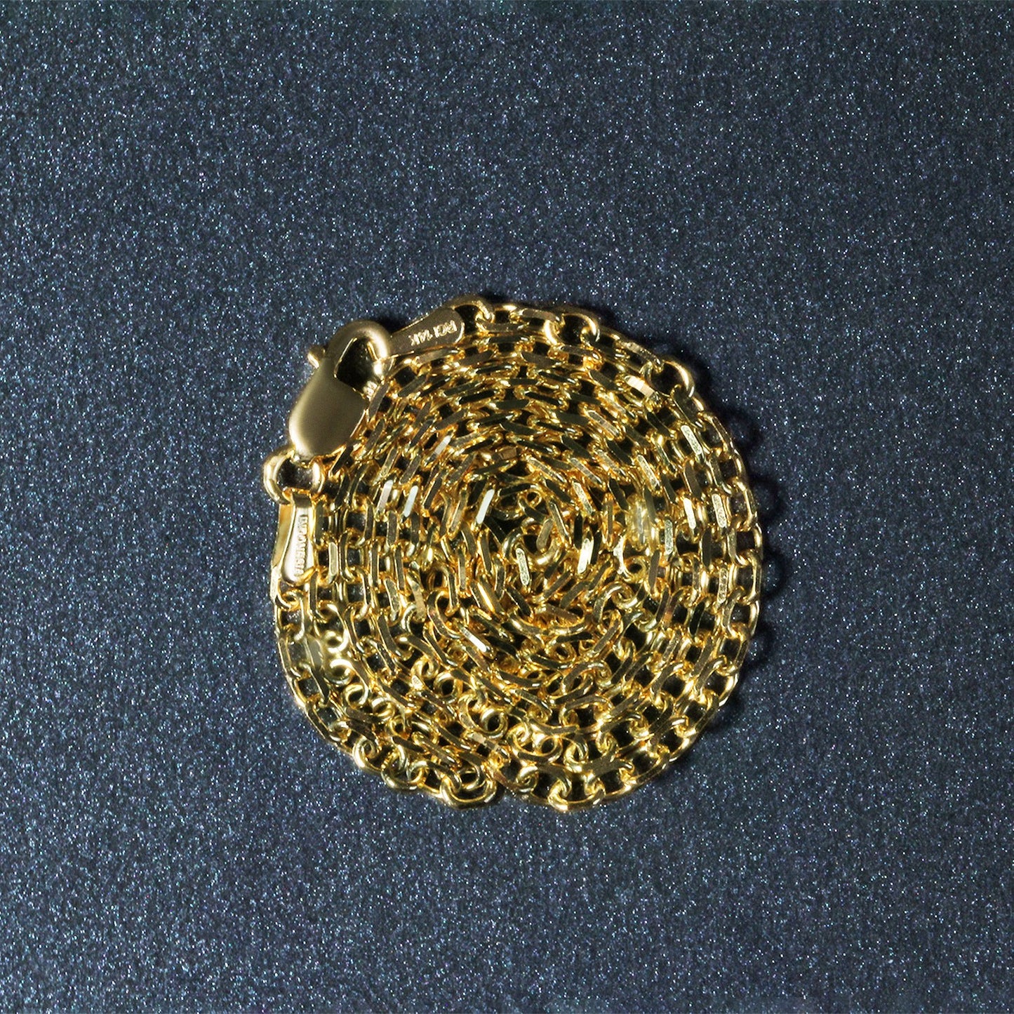 Peelerie jewelry piece in midnight luxury editorial product photo, high-contrast studio lighting