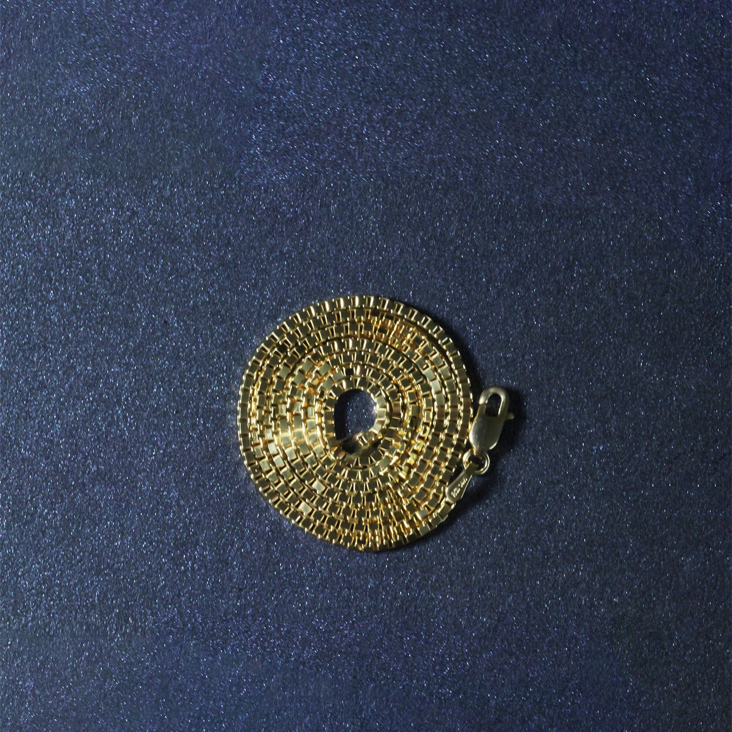 Peelerie jewelry piece in gold midnight luxury editorial product photo, high-contrast studio lighting