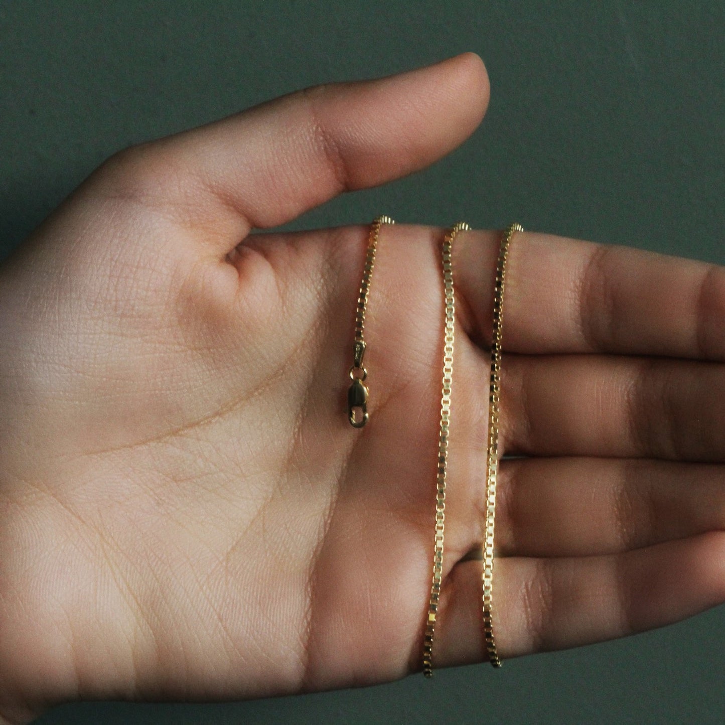 Peelerie jewelry piece in midnight luxury editorial product photo, high-contrast studio lighting