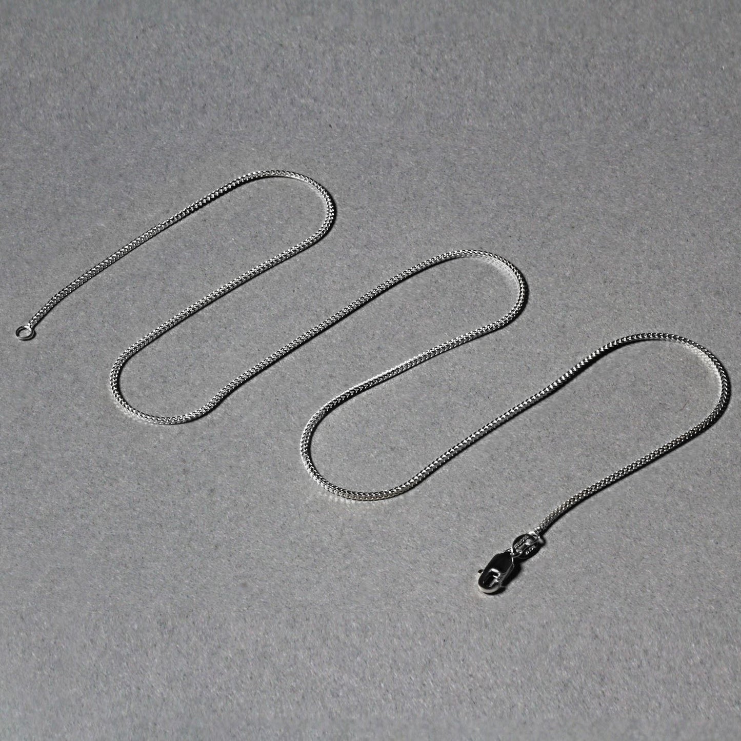 Peelerie jewelry piece in midnight luxury editorial product photo, high-contrast studio lighting