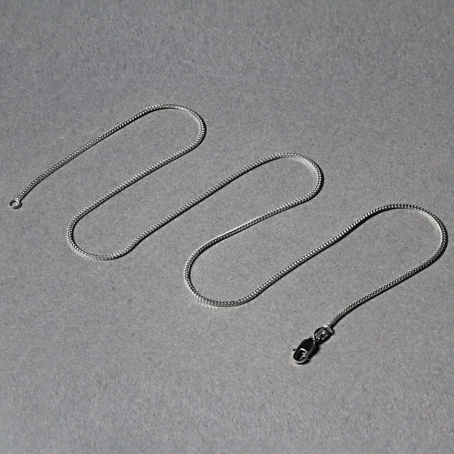 Peelerie jewelry piece in midnight luxury editorial product photo, high-contrast studio lighting