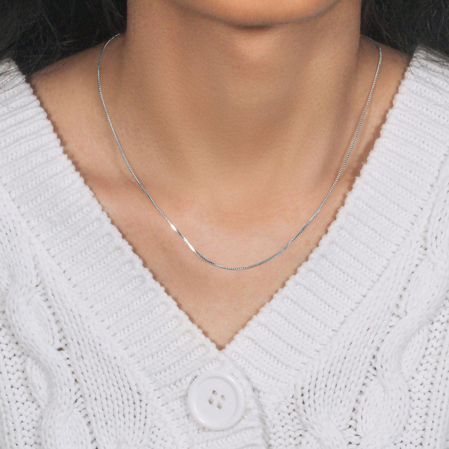 Peelerie jewelry piece in midnight luxury editorial product photo, high-contrast studio lighting