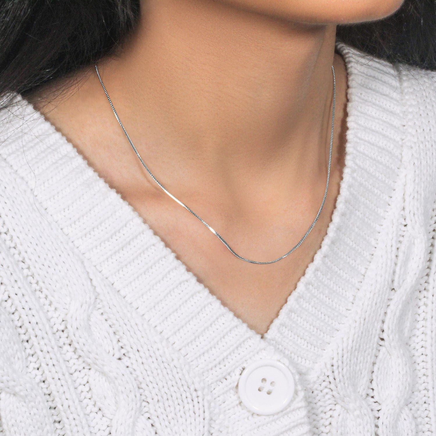 Peelerie jewelry piece in midnight luxury editorial product photo, high-contrast studio lighting