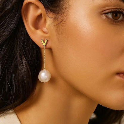 14k yellow gold drop earrings set with pearl
