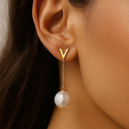 14k yellow gold drop earrings set with pearl