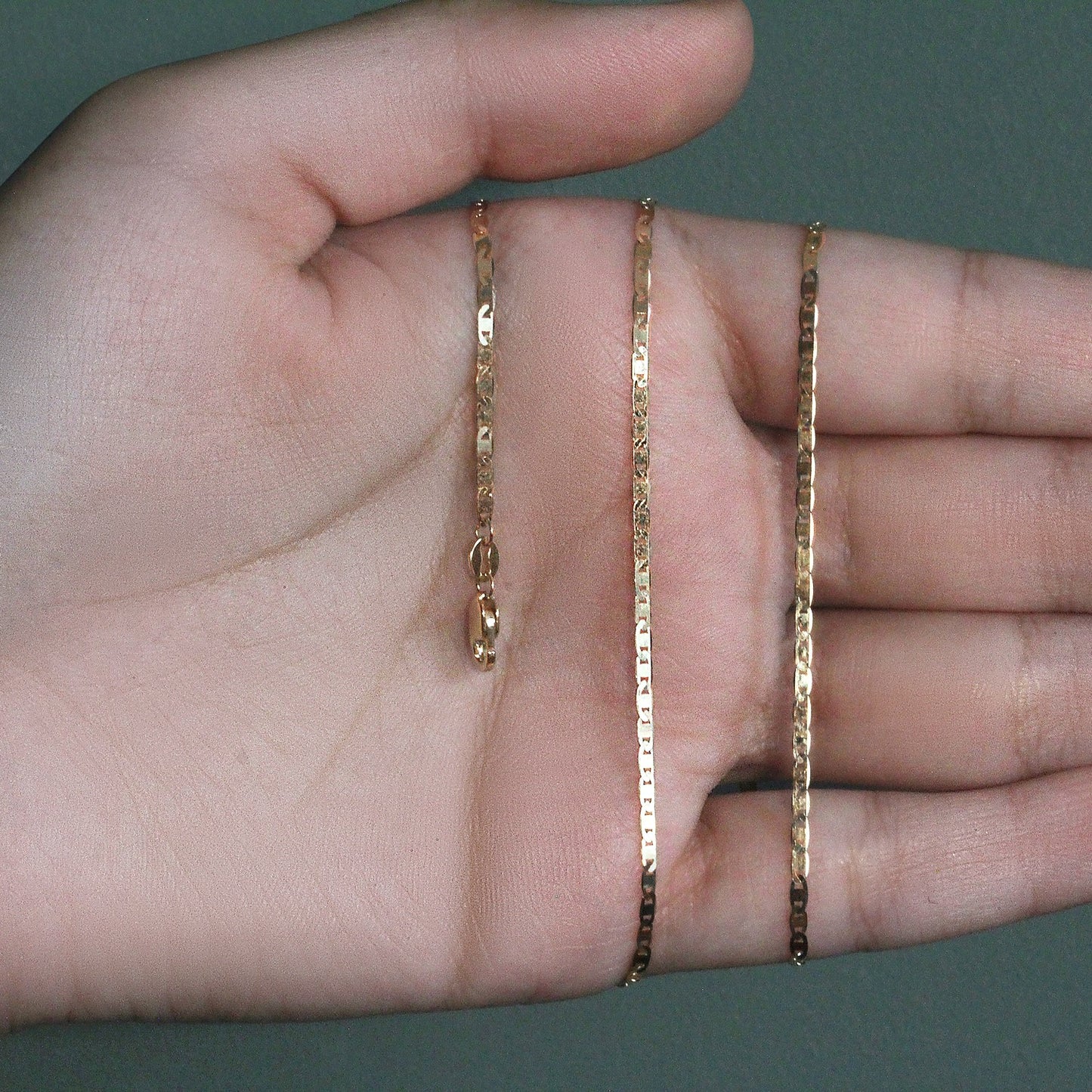 Peelerie jewelry piece in midnight luxury editorial product photo, high-contrast studio lighting