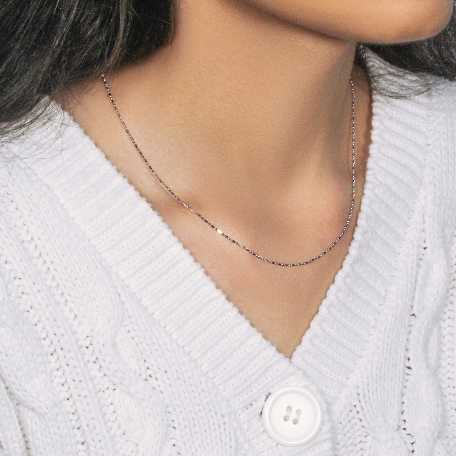 Peelerie jewelry piece in midnight luxury editorial product photo, high-contrast studio lighting