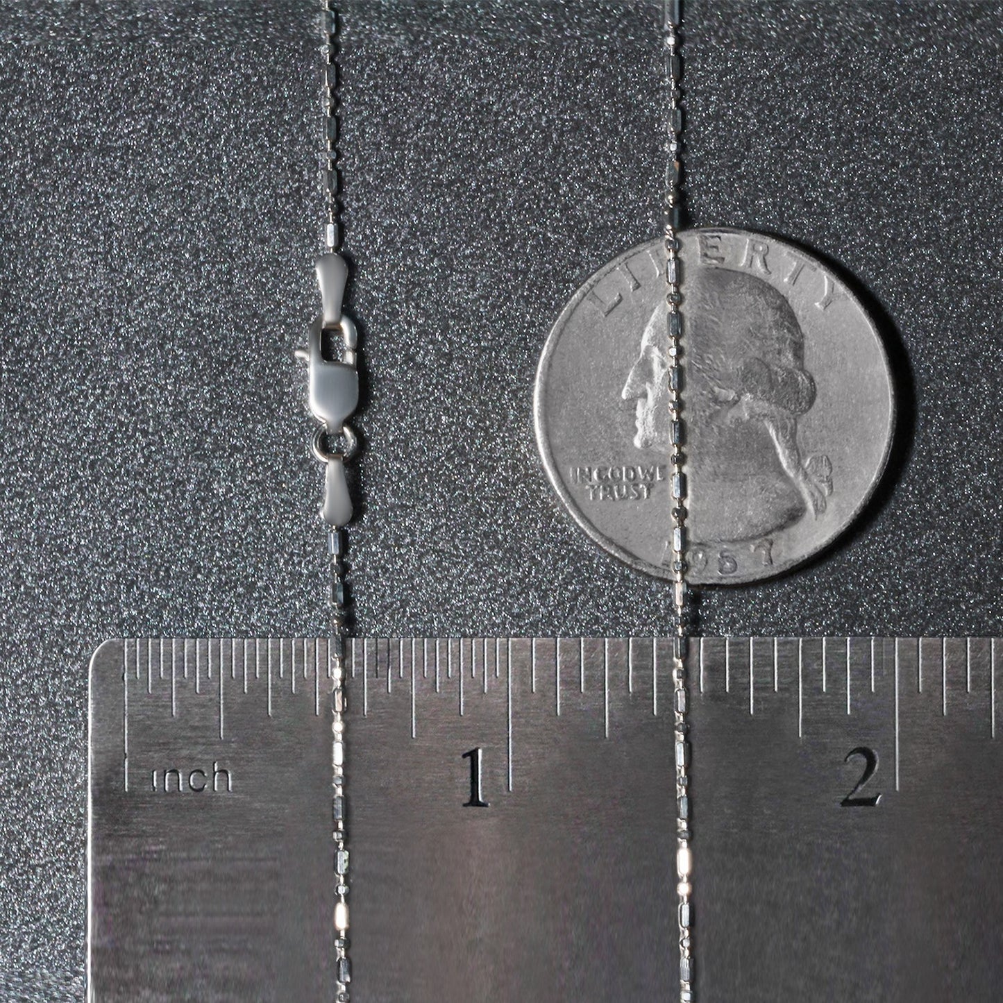 Peelerie jewelry piece in midnight luxury editorial product photo, high-contrast studio lighting