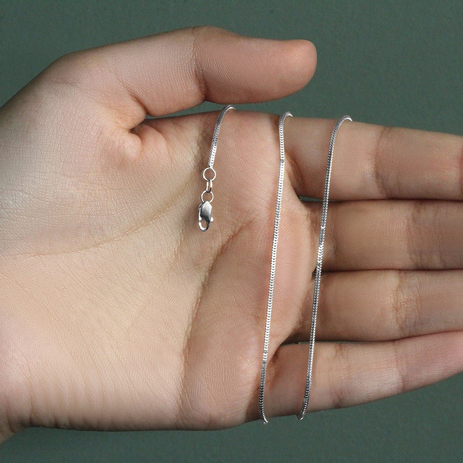 Peelerie jewelry piece in midnight luxury editorial product photo, high-contrast studio lighting