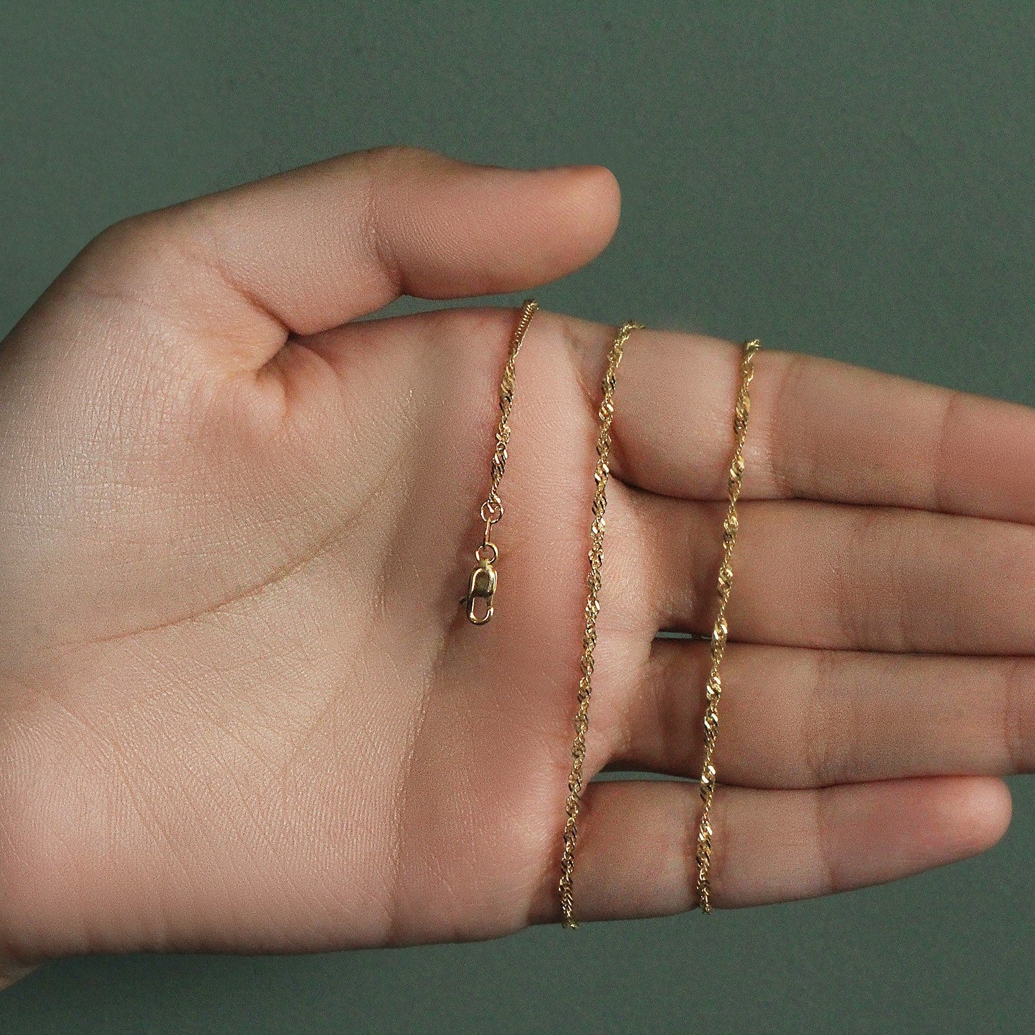 Peelerie jewelry piece in midnight luxury editorial product photo, high-contrast studio lighting