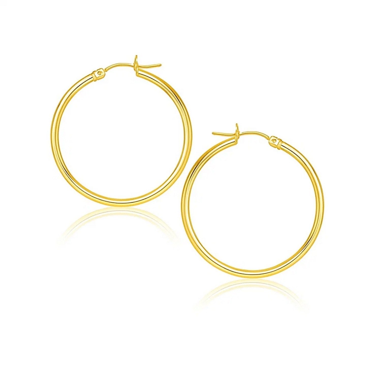 10k Yellow Gold Polished Hoop Earrings (2x25mm) in a sleek high-contrast midnight luxury editorial style