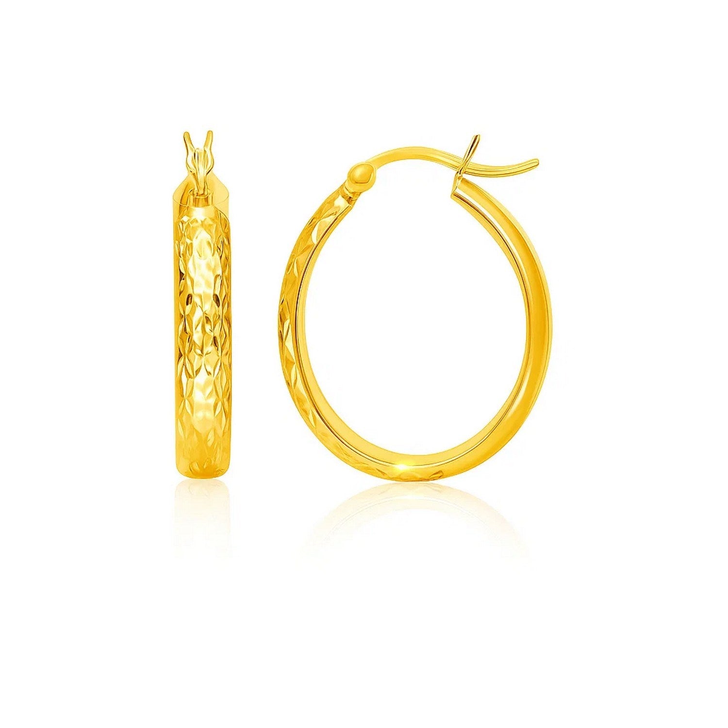 10k Yellow Gold Hammered Oval Hoop Earrings in a sleek high-contrast midnight luxury editorial style