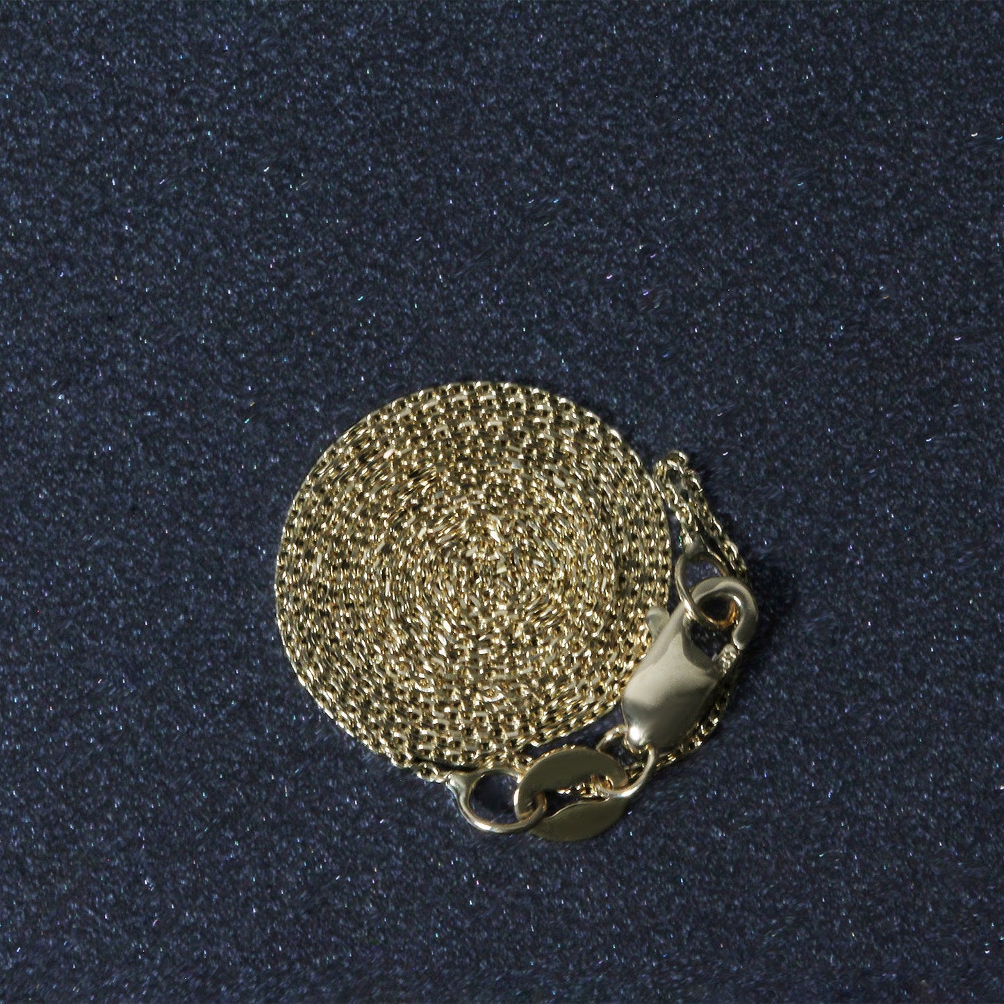 Peelerie jewelry piece in midnight luxury editorial product photo, high-contrast studio lighting