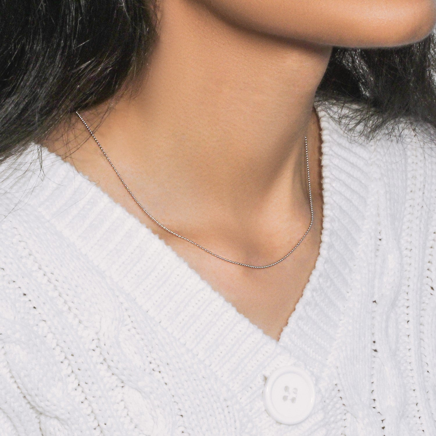 Peelerie jewelry piece in midnight luxury editorial product photo, high-contrast studio lighting