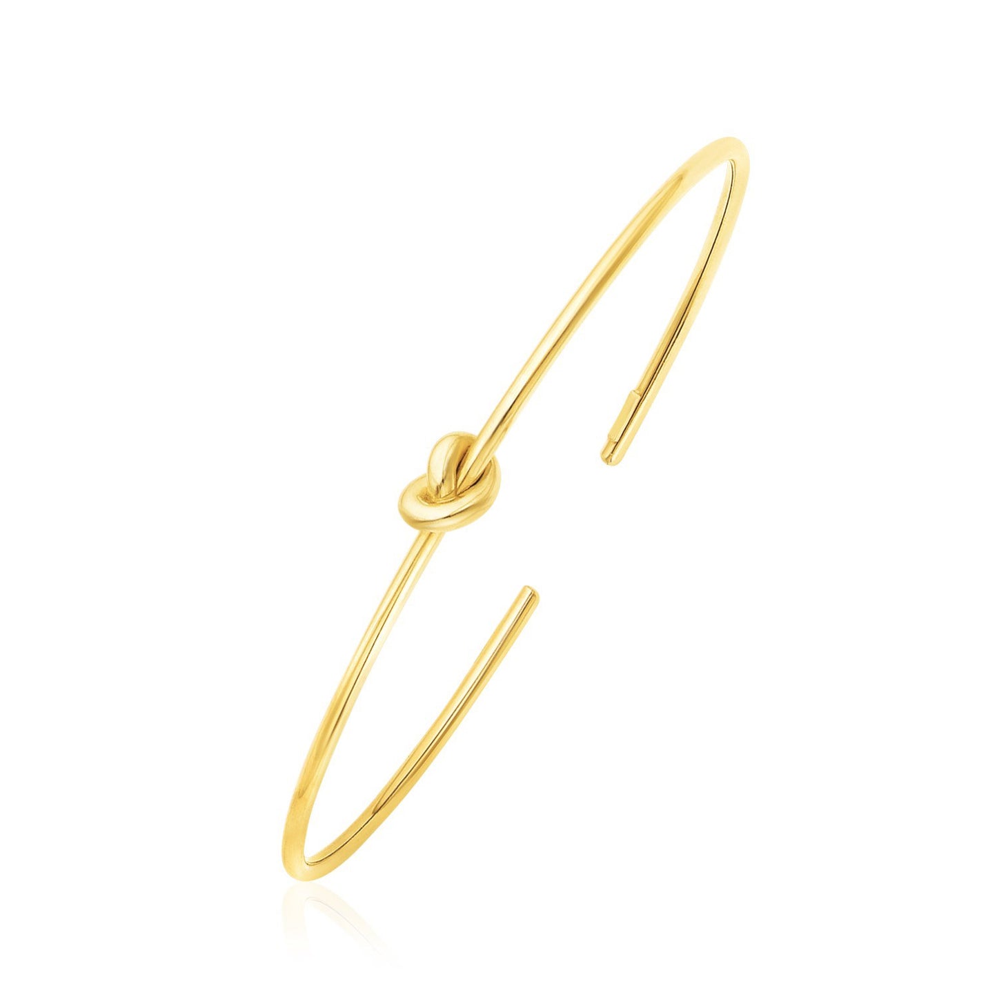 14k Yellow Gold Polished Cuff Bangle with Knot (5.50 mm) in a sleek high-contrast midnight luxury editorial style