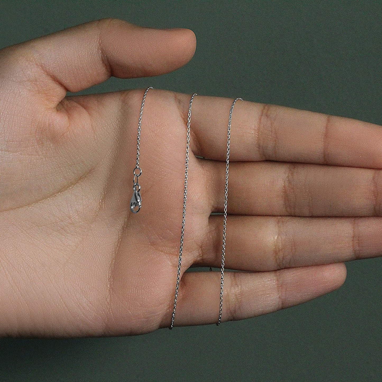 Peelerie jewelry piece in midnight luxury editorial product photo, high-contrast studio lighting