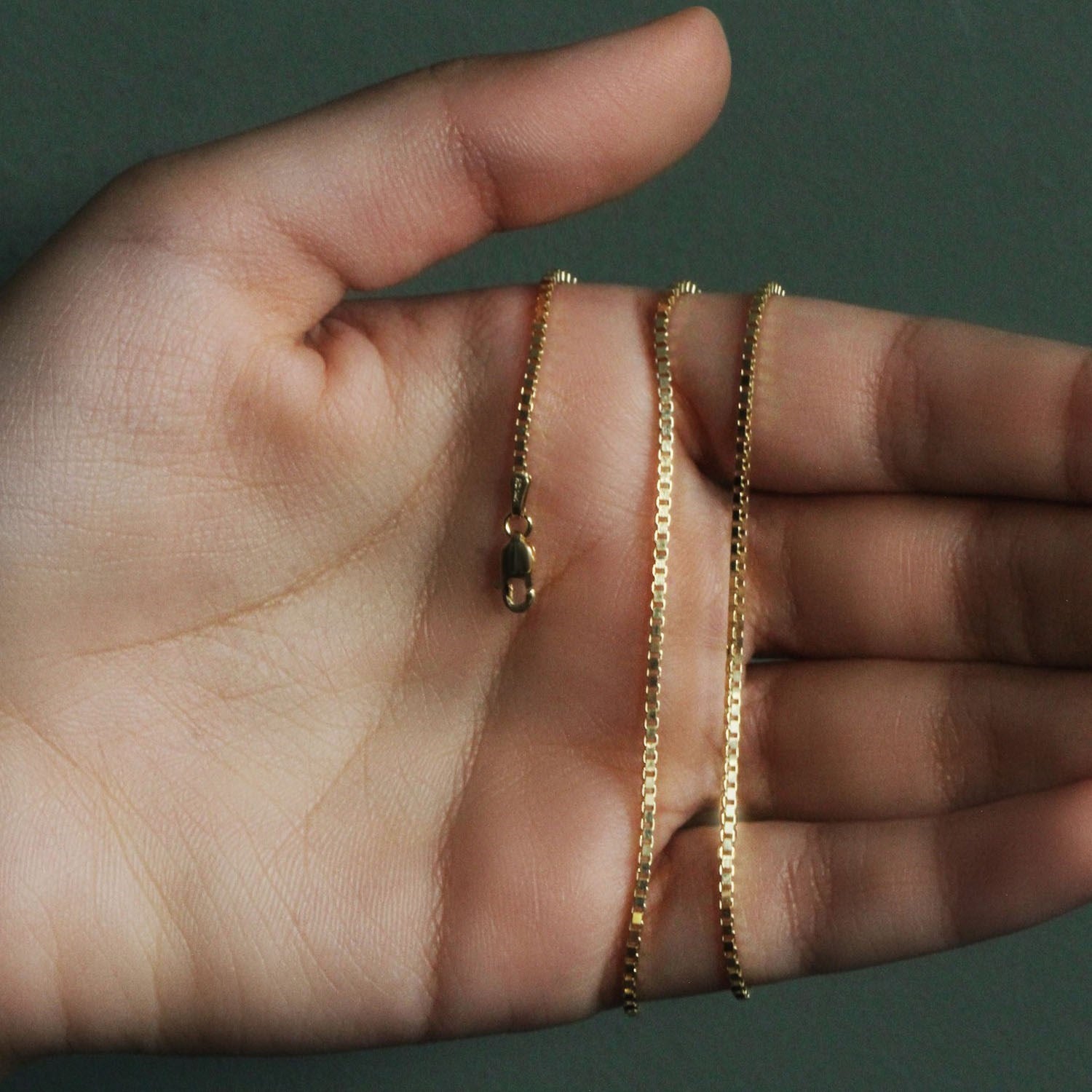 Peelerie jewelry piece in midnight luxury editorial product photo, high-contrast studio lighting