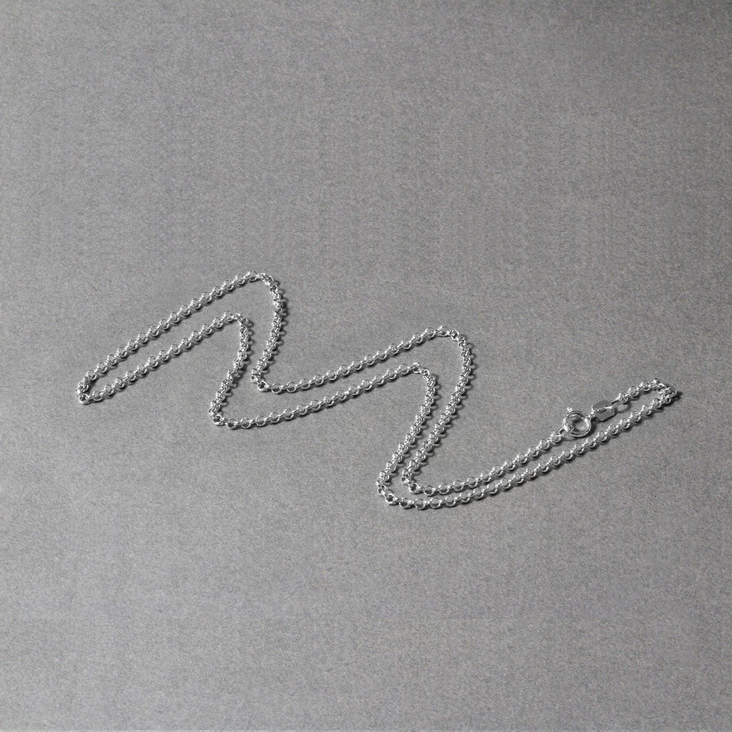 Peelerie jewelry piece in midnight luxury editorial product photo, high-contrast studio lighting