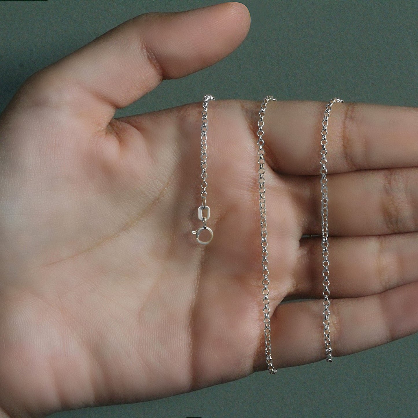 Peelerie jewelry piece in midnight luxury editorial product photo, high-contrast studio lighting