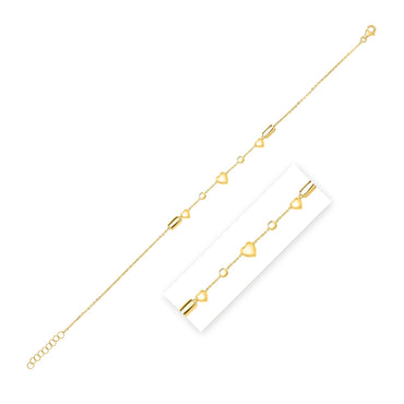 14k Yellow Gold Puff Heart Adjustable Anklet in a sleek high-contrast midnight luxury editorial style