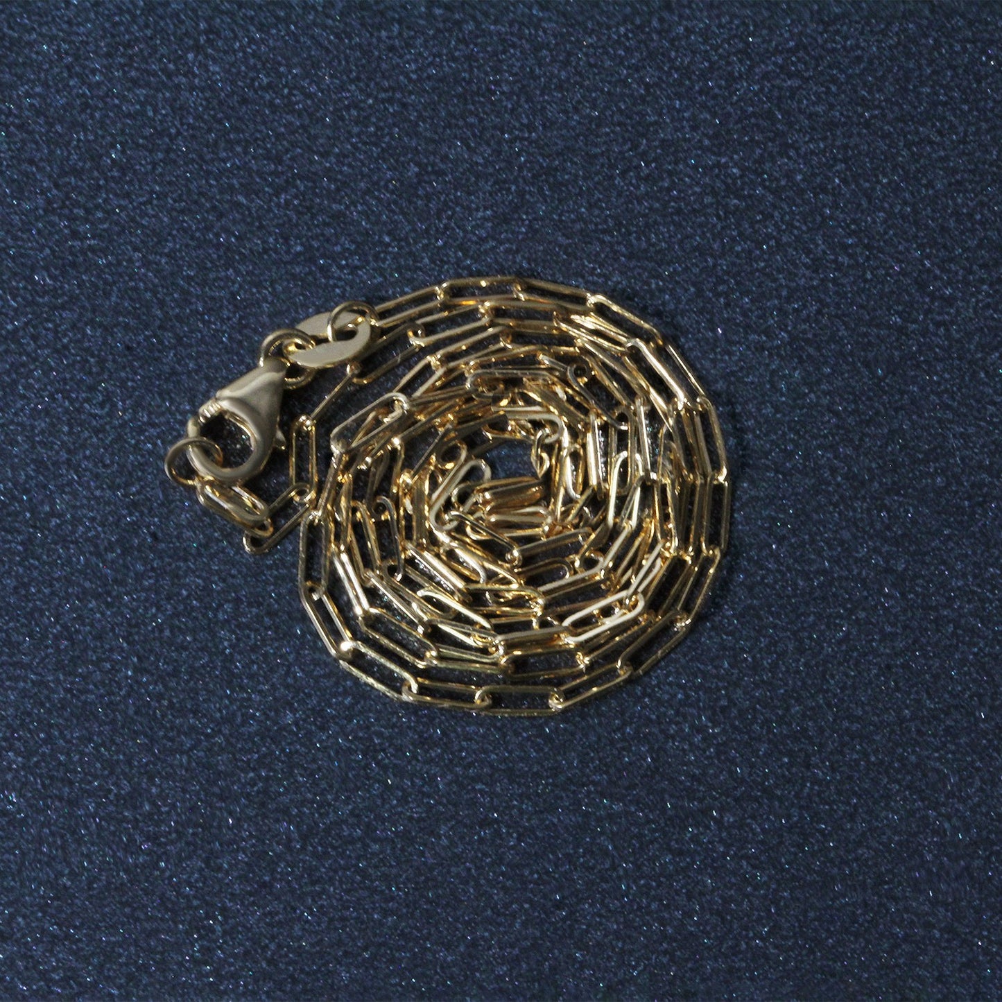 Peelerie jewelry piece in midnight luxury editorial product photo, high-contrast studio lighting