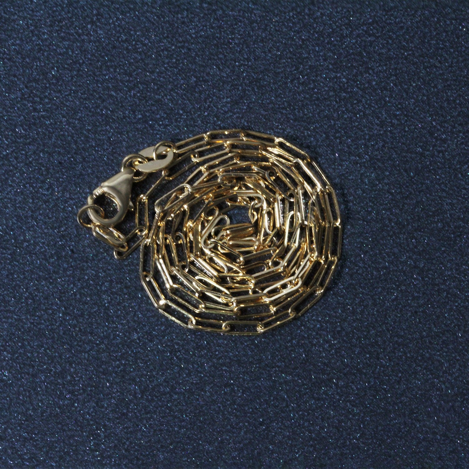 Peelerie jewelry piece in midnight luxury editorial product photo, high-contrast studio lighting