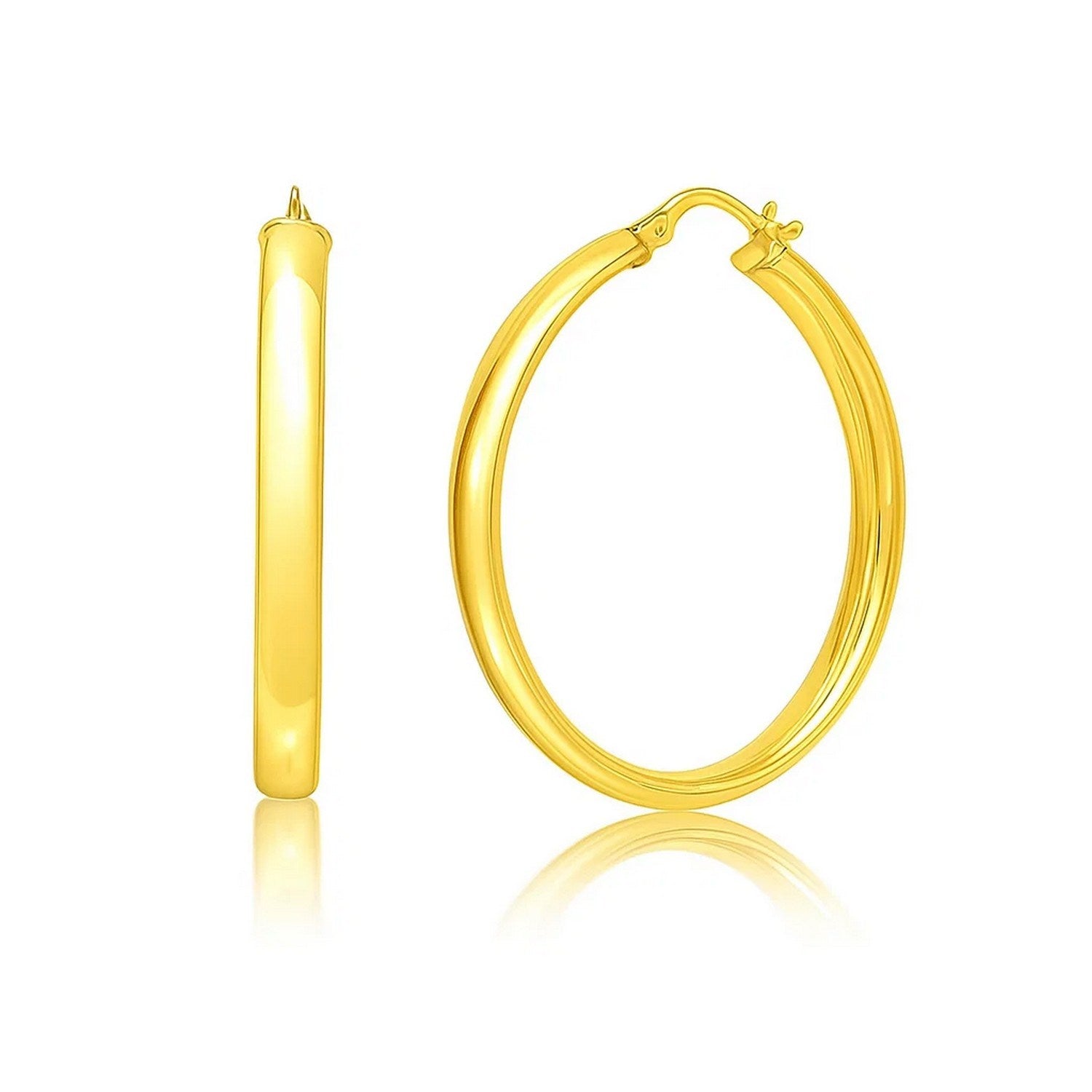 Medium Wedding Hoop Earrings in 14K Yellow Gold in a sleek high-contrast midnight luxury editorial style