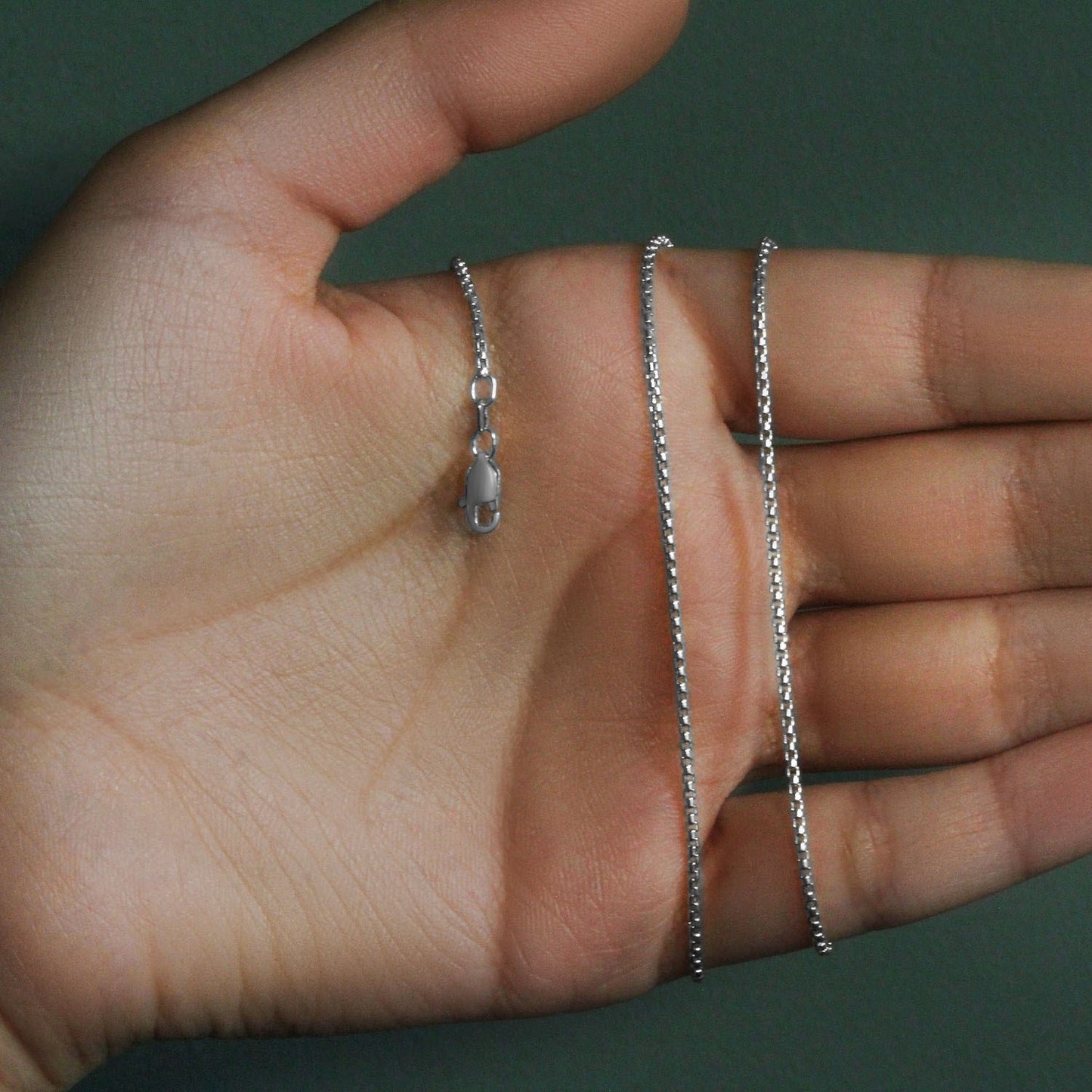 Peelerie jewelry piece in midnight luxury editorial product photo, high-contrast studio lighting