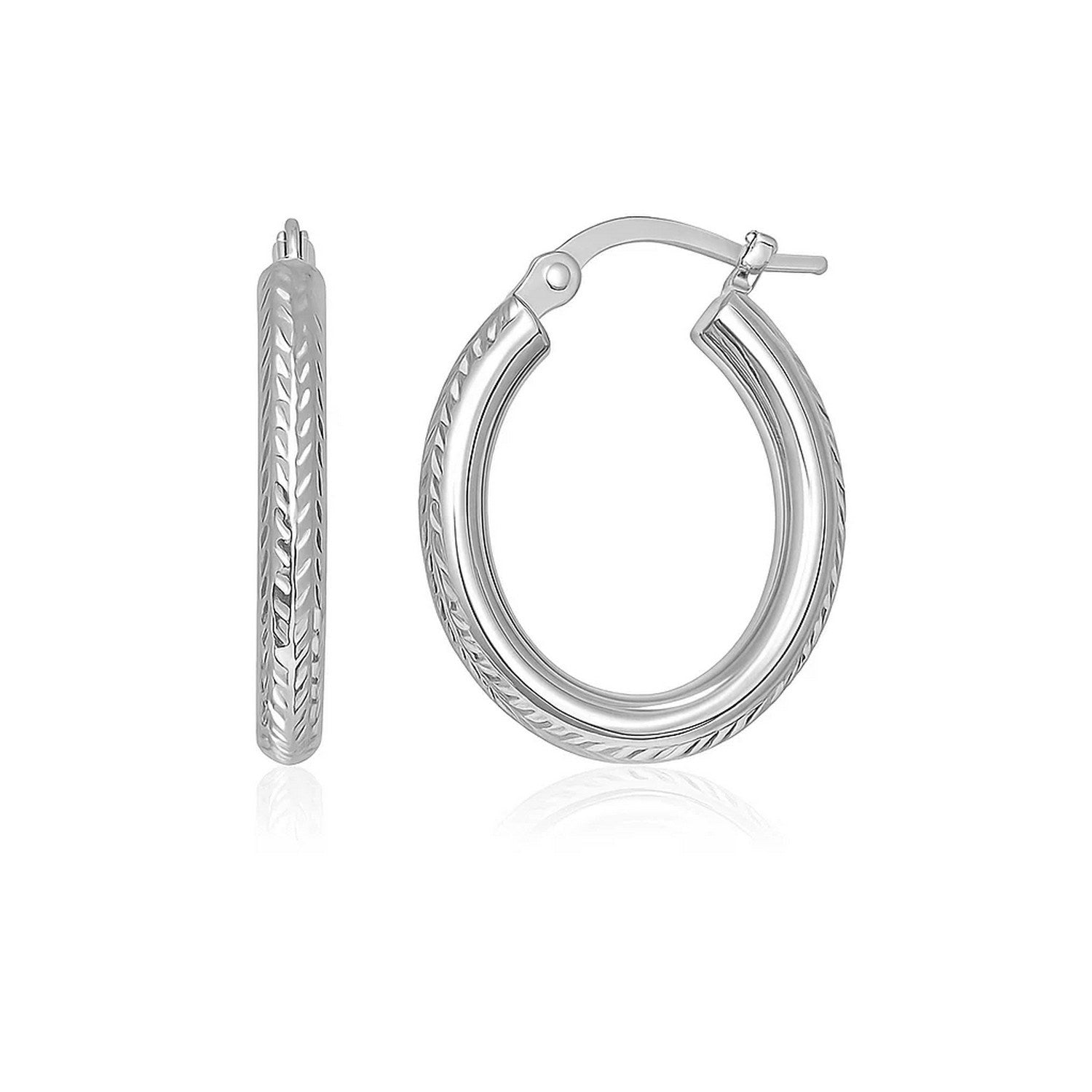 14k White Gold Diamond Cut Textured Oval Hoop Earrings. in a sleek high-contrast midnight luxury editorial style