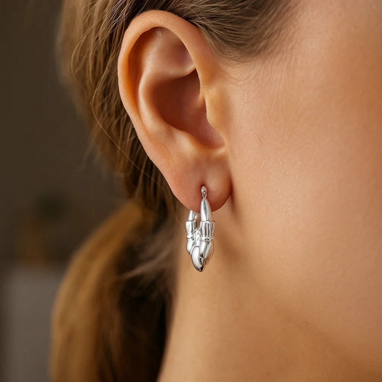 Peelerie jewelry piece in midnight luxury editorial product photo, high-contrast studio lighting