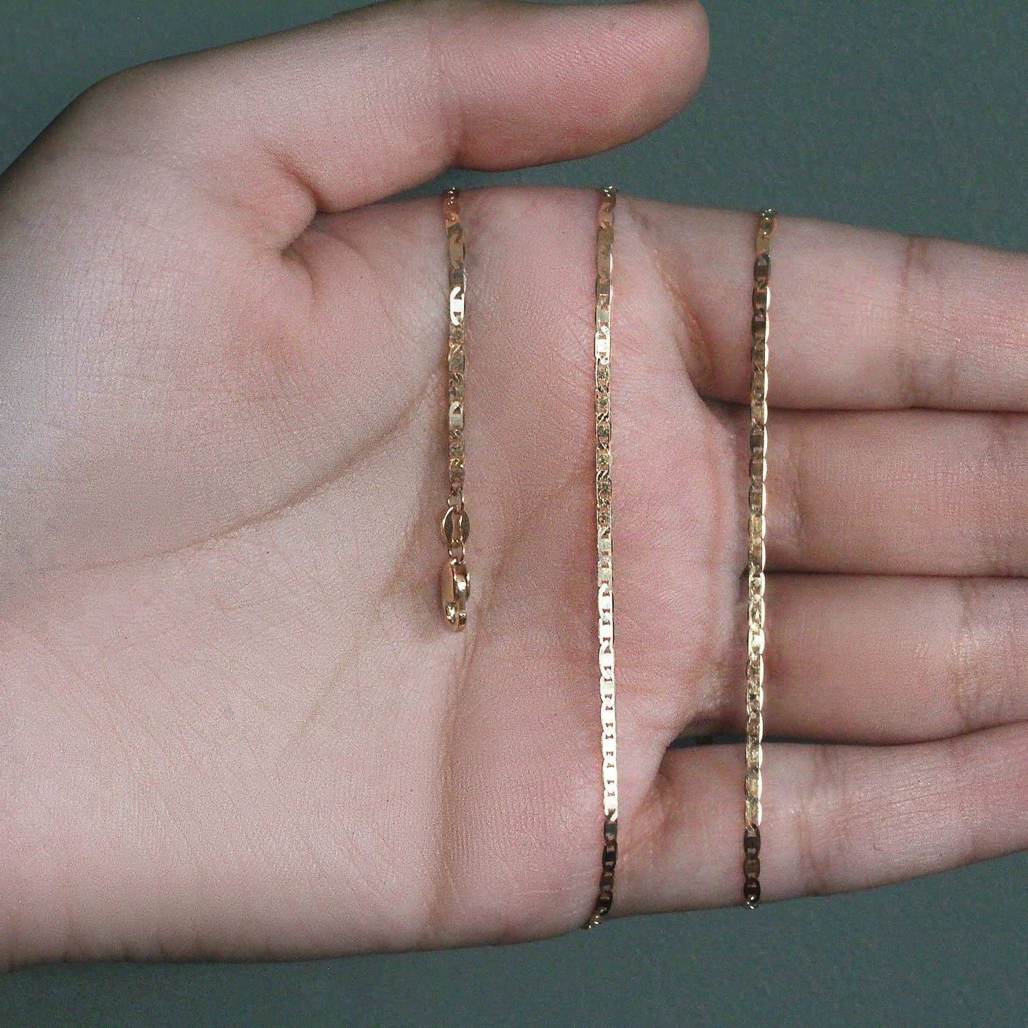 Peelerie jewelry piece in gold midnight luxury editorial product photo, high-contrast studio lighting