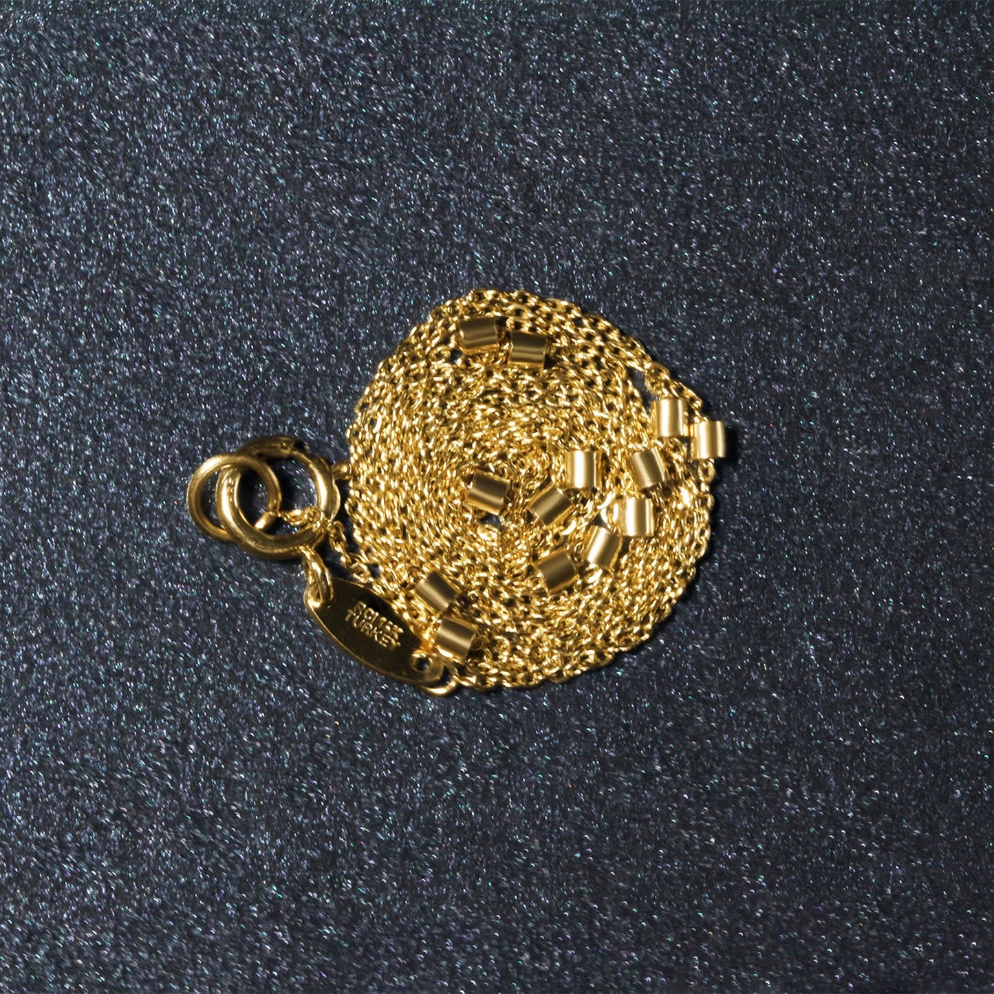 Peelerie jewelry piece in midnight luxury editorial product photo, high-contrast studio lighting