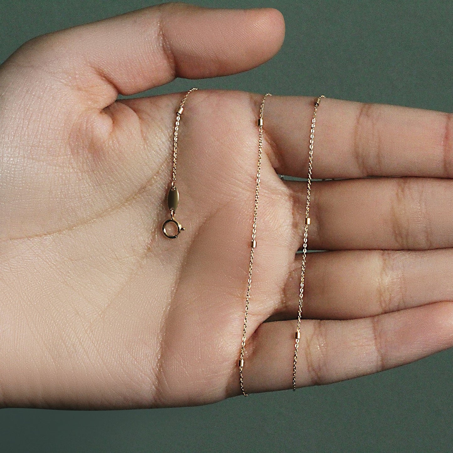 Peelerie jewelry piece in midnight luxury editorial product photo, high-contrast studio lighting