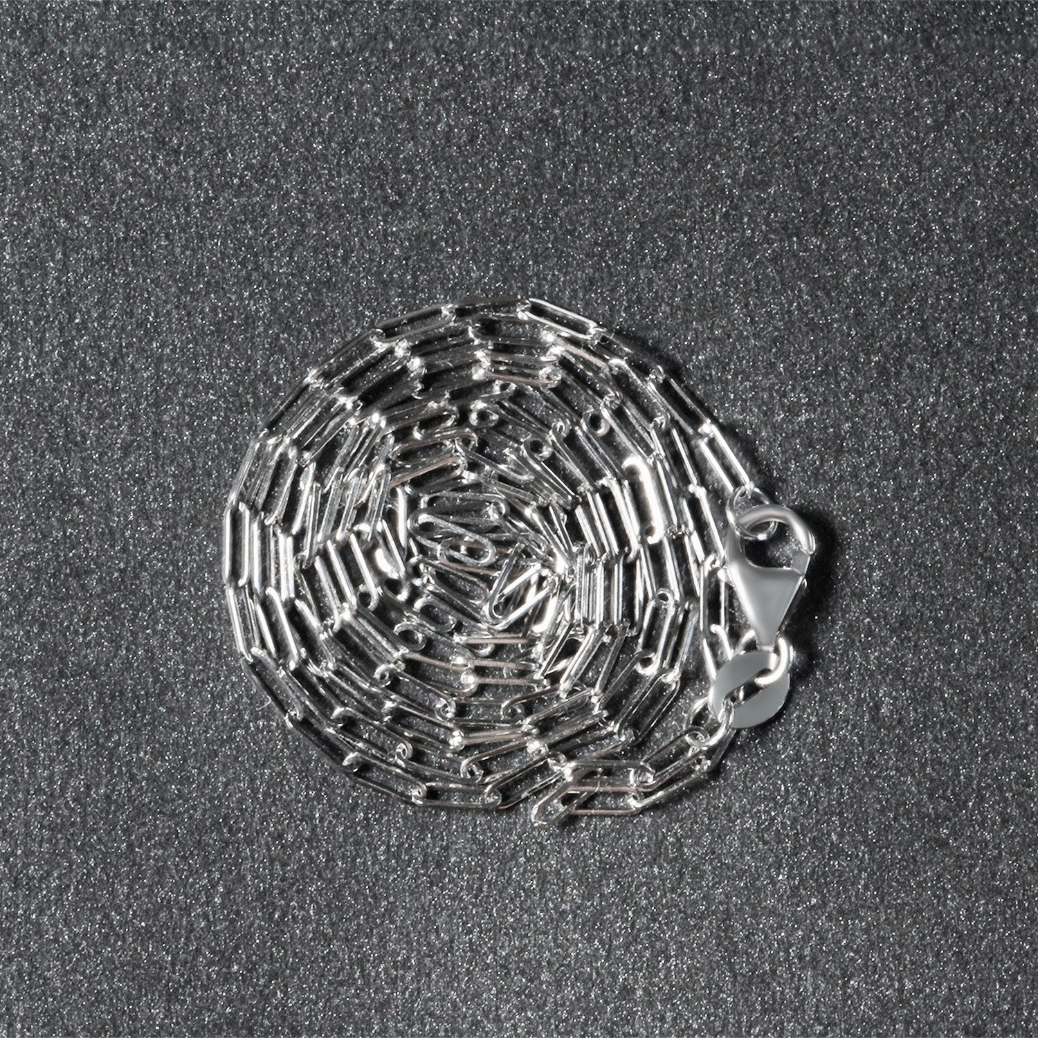 Peelerie jewelry piece in midnight luxury editorial product photo, high-contrast studio lighting