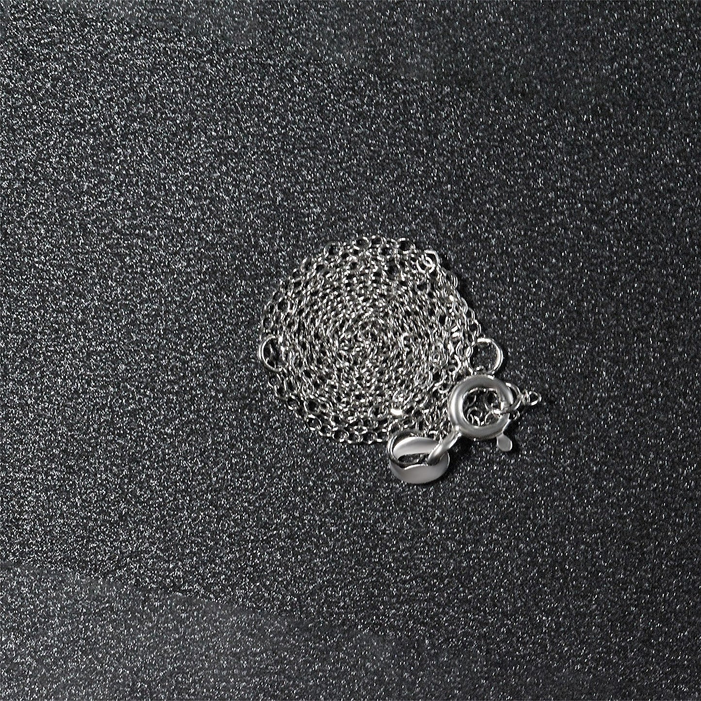 Peelerie jewelry piece in midnight luxury editorial product photo, high-contrast studio lighting