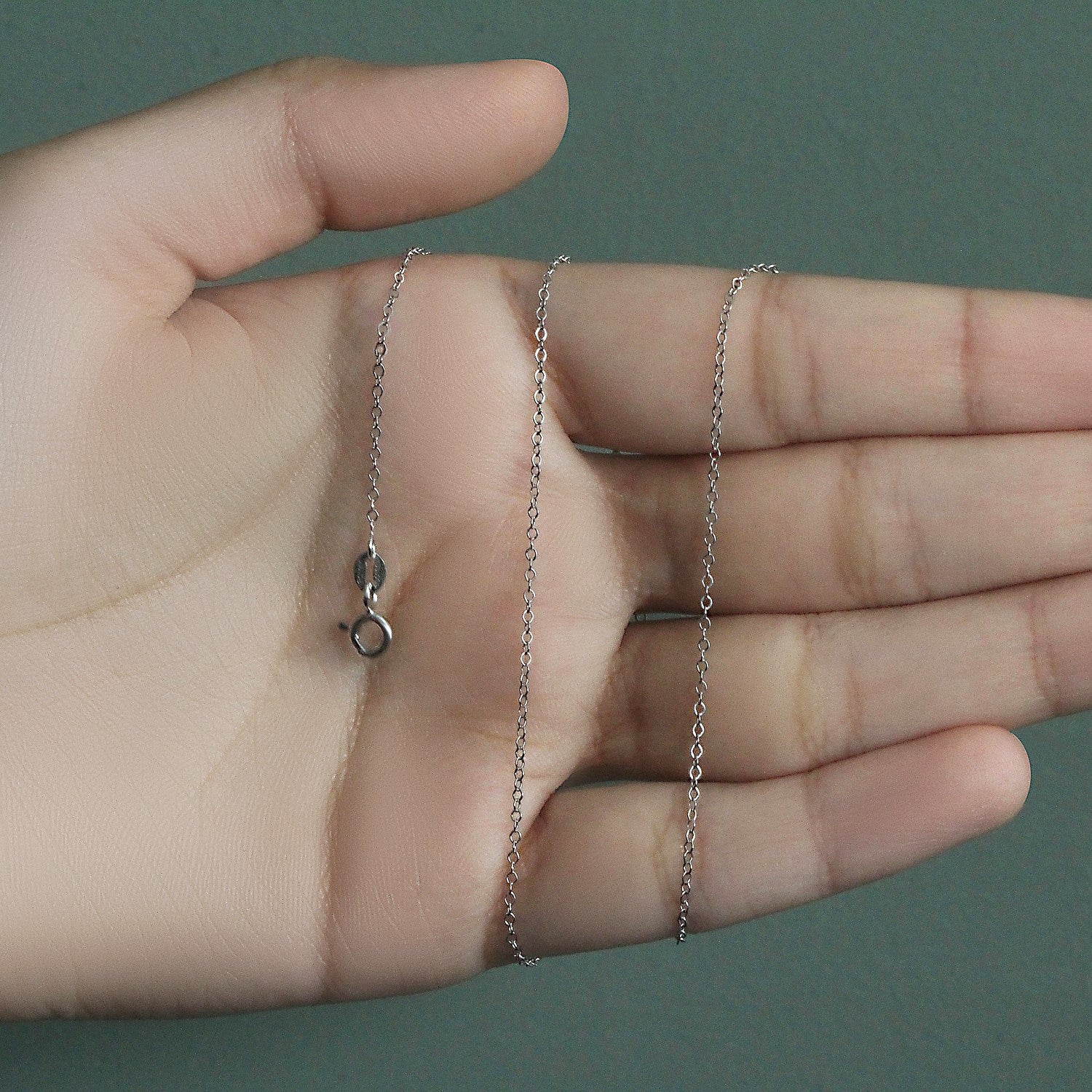 Peelerie jewelry piece in midnight luxury editorial product photo, high-contrast studio lighting