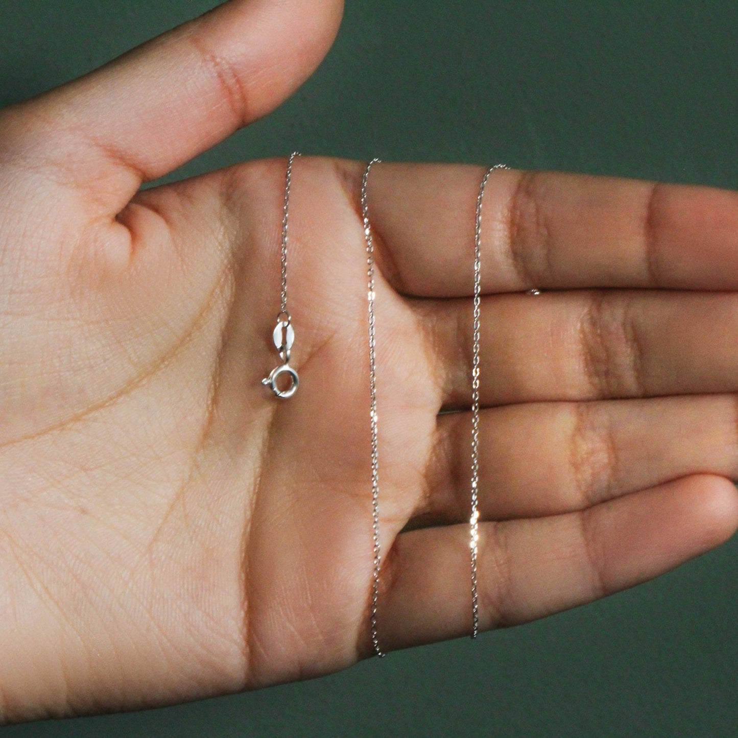 Peelerie jewelry piece in midnight luxury editorial product photo, high-contrast studio lighting