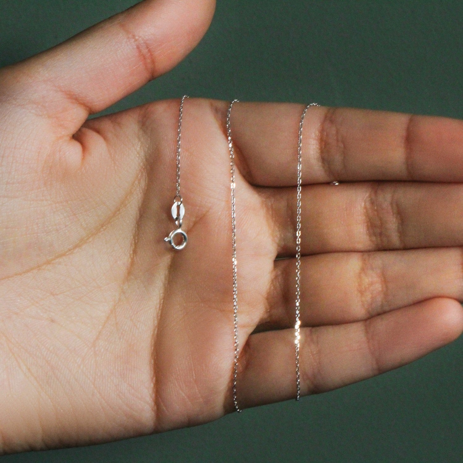 Peelerie jewelry piece in midnight luxury editorial product photo, high-contrast studio lighting