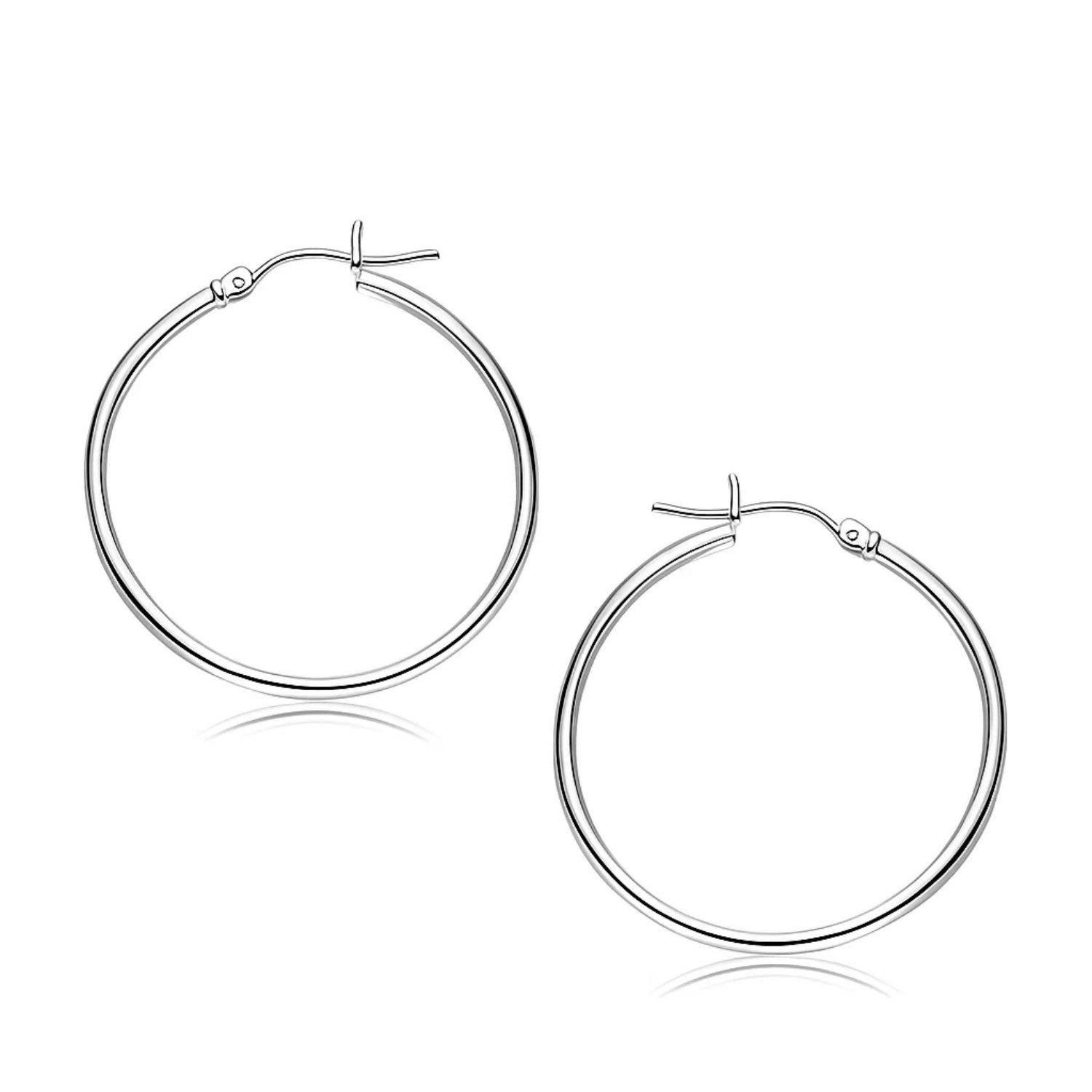 10k White Gold Polished Hoop Earrings (2x30 mm) in a sleek high-contrast midnight luxury editorial style