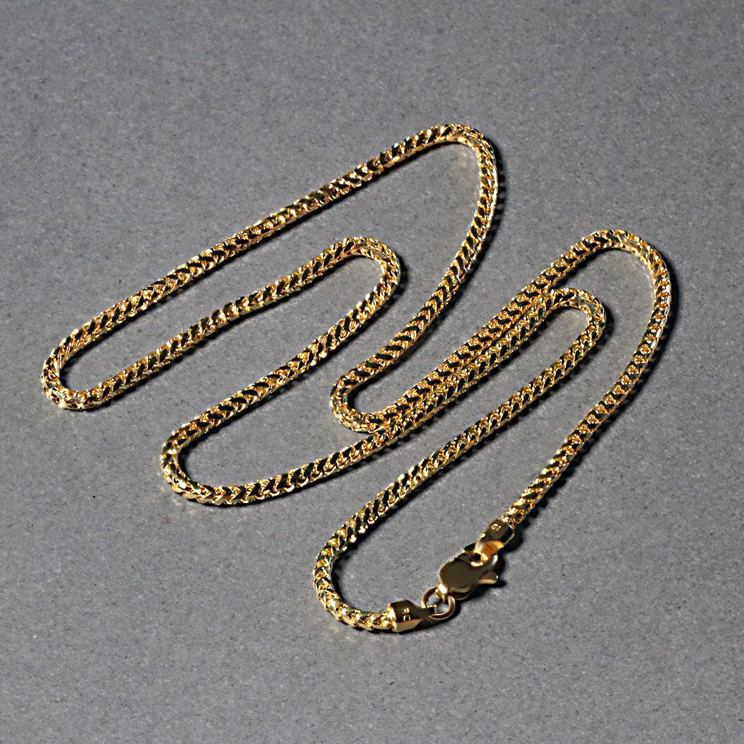 Peelerie jewelry piece in midnight luxury editorial product photo, high-contrast studio lighting