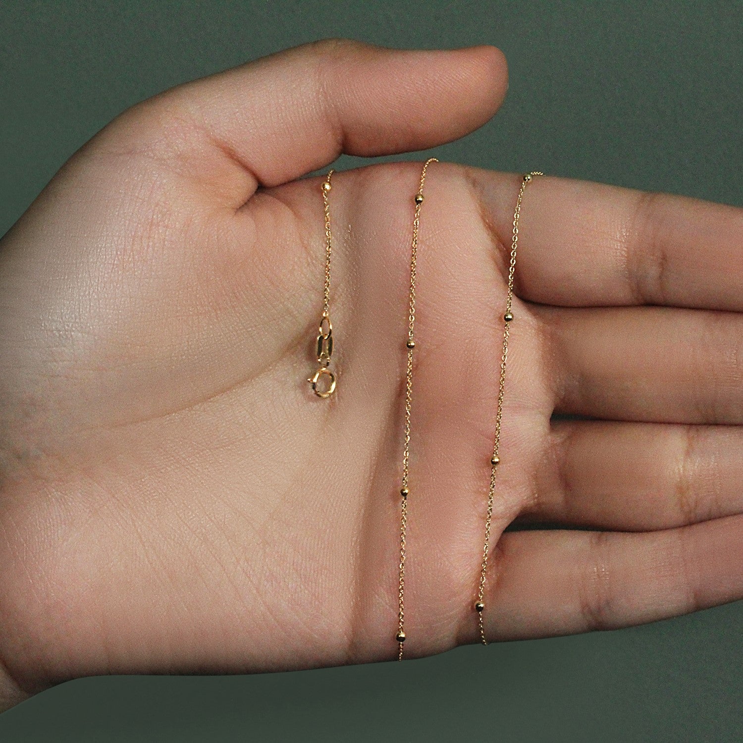 Peelerie jewelry piece in midnight luxury editorial product photo, high-contrast studio lighting