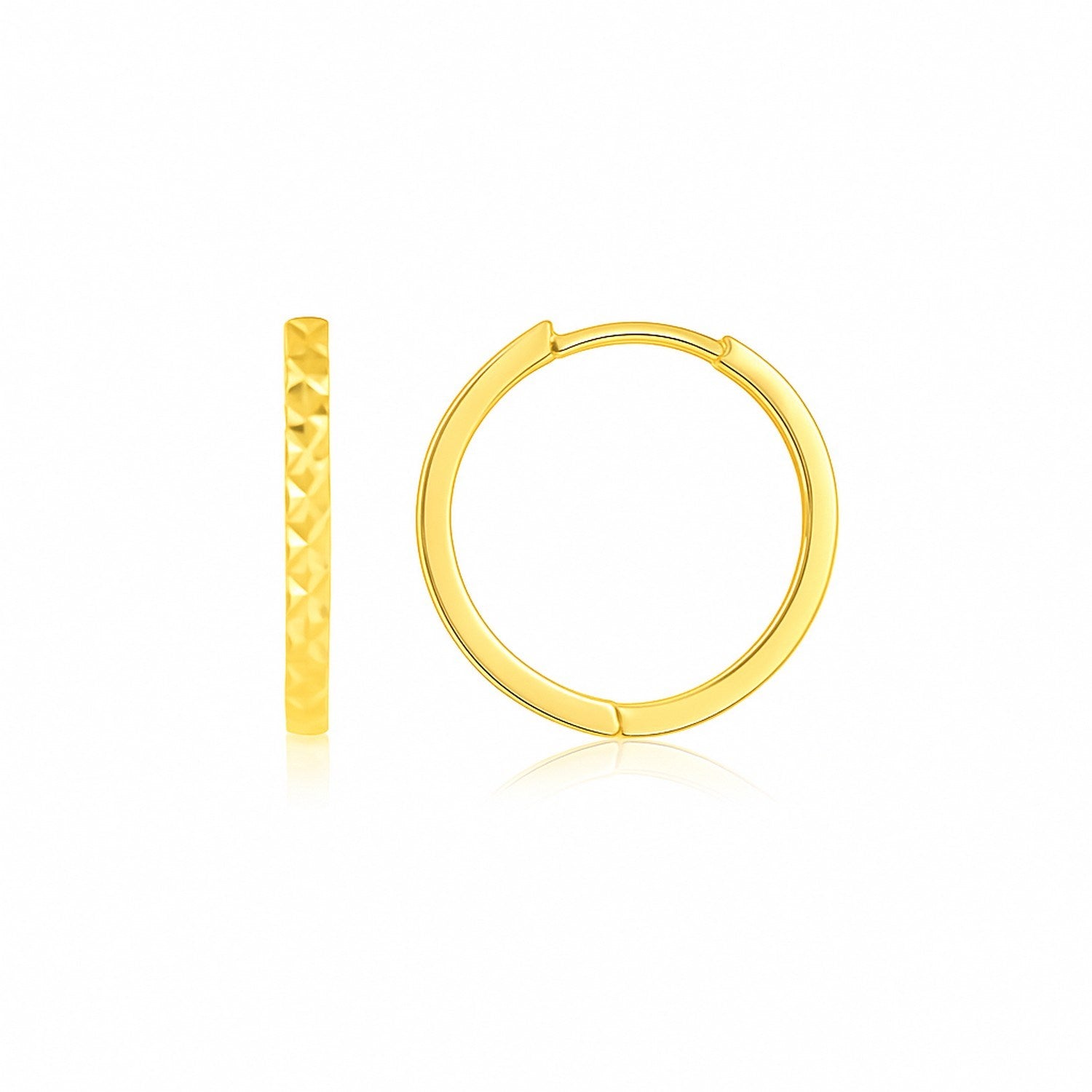 14k Yellow Gold Diamond Cut Textured Huggie Earrings in a sleek high-contrast midnight luxury editorial style