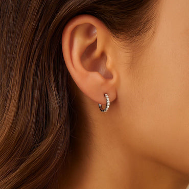 Peelerie jewelry piece in midnight luxury editorial product photo, high-contrast studio lighting