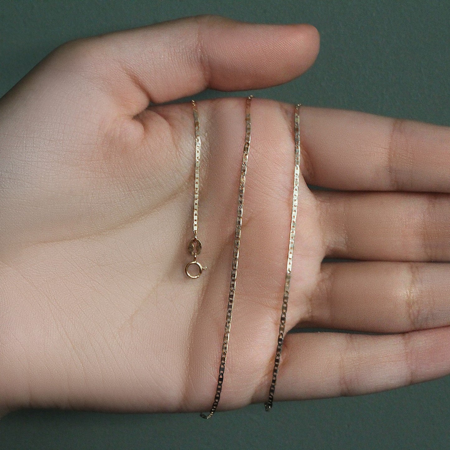 Peelerie jewelry piece in midnight luxury editorial product photo, high-contrast studio lighting