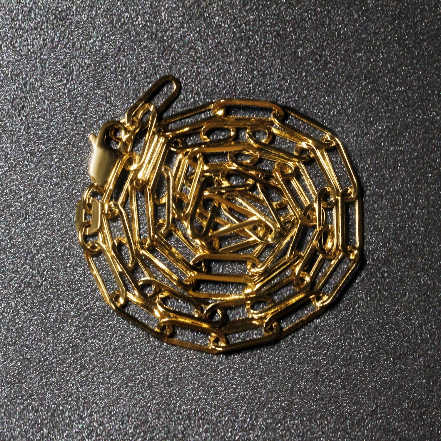 Peelerie jewelry piece in midnight luxury editorial product photo, high-contrast studio lighting