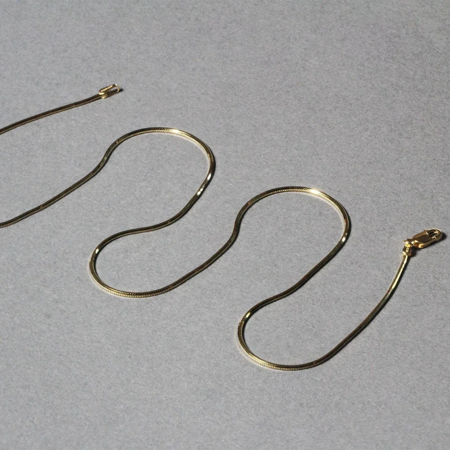 1.0mm 14K Yellow Gold Octagonal Shiny Snake Chain - Peelerie