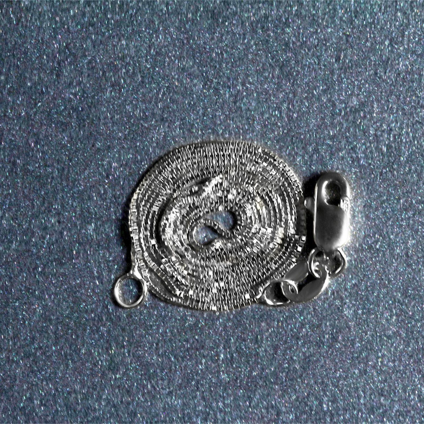 Peelerie jewelry piece in midnight luxury editorial product photo, high-contrast studio lighting