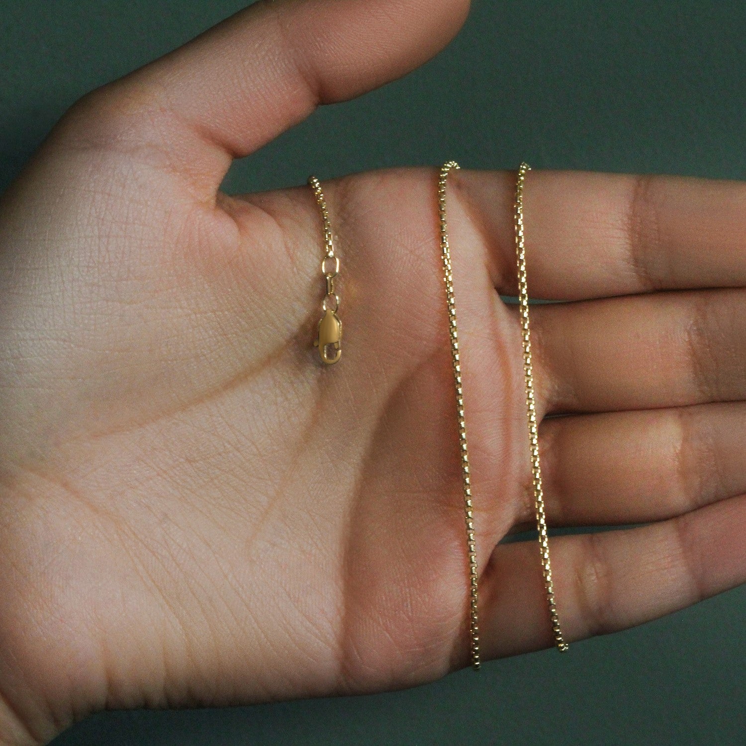 Peelerie jewelry piece in midnight luxury editorial product photo, high-contrast studio lighting