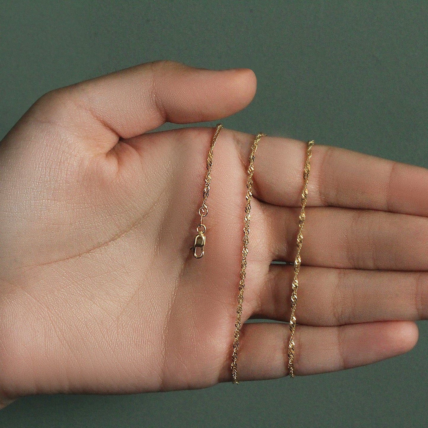 Peelerie jewelry piece in midnight luxury editorial product photo, high-contrast studio lighting